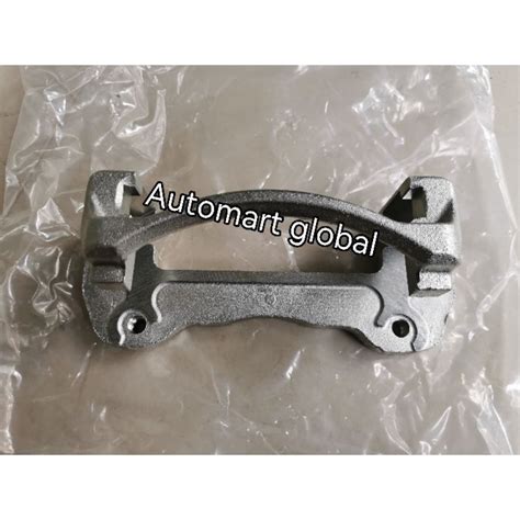 Bracket Caliper Rem Depan - raincitystudios.com