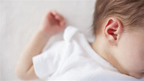 Baby seemingly enjoys ear brushing so much she cries when it