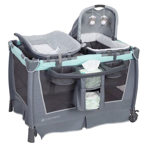 Product Description. Your little one will feel comfy and secure in the adorable Lil' Snooze Deluxe II Nursery Center from Baby Trend. The removable napper with canopy is perfect for a little shuteye throughout the day and the hanging toys keep them entertained while awake. Diaper time is a breeze with the flip away changing table and storage .... 