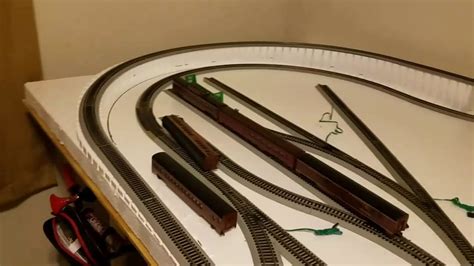 Bachmann train layouts. The locomotive weighs 1.6 ounces. Testing revealed a drawbar pull of .48 ounce, the equivalent of 12 cars on straight and level track. On our new N scale project layout, the Bachmann NW2 was able to pull a 12-car train around the level layout and through staging. 