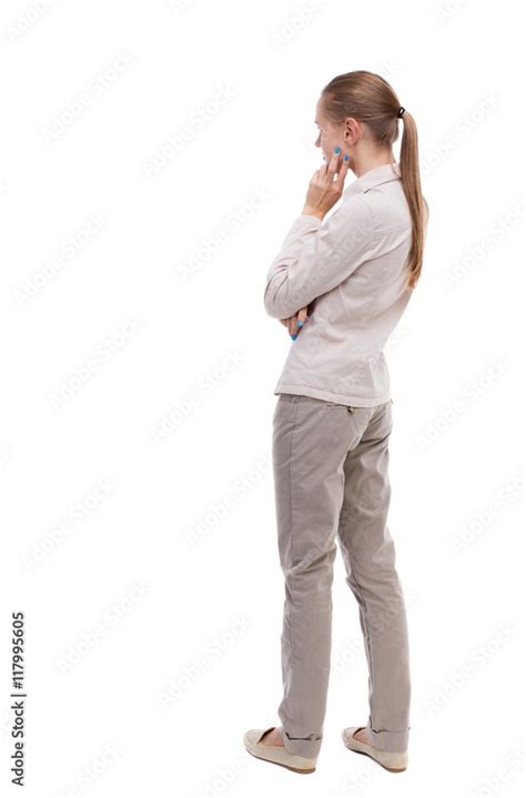 Back view of woman standing on Stock Photos and Images