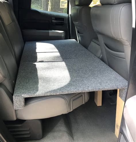 For those with smaller breeds, the PetSafe Solvit is a great dog bed for the back seat of a truck. Features . 2-in-one dog bed and seat cover. Fits dogs up to 30 lbs. Keeps dog hair off your car seats. Soft microsuede liner over the bolster cushion. Adjustable headrest strap and seat anchor makes it easy to install; Machine-washable. Pro & Cons. 