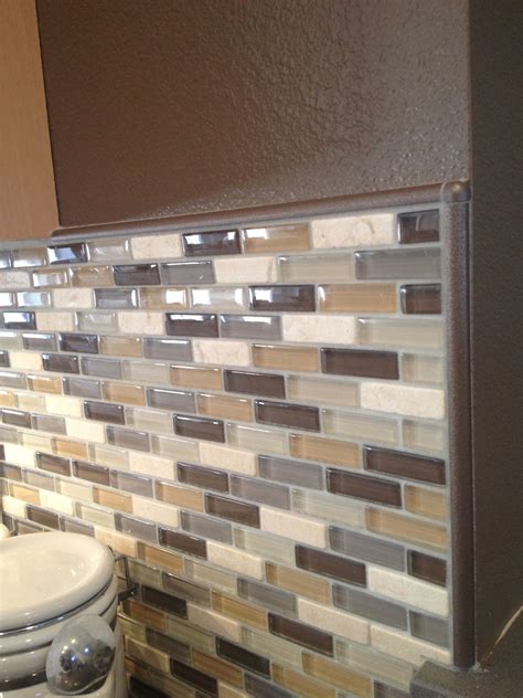 Are you wondering how to give your kitchen backsplash a finished look? In this glass tile tutorial, Brian Fitzgerald, Senior Technical Services Rep with Ocea.... 