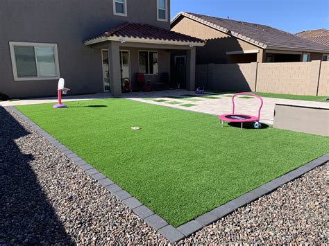 Backyard turf. A mixture of hardscape and plush artificial grass creates the perfect balance during backyard redesign projects. This artificial grass stepping stones combo is ... 