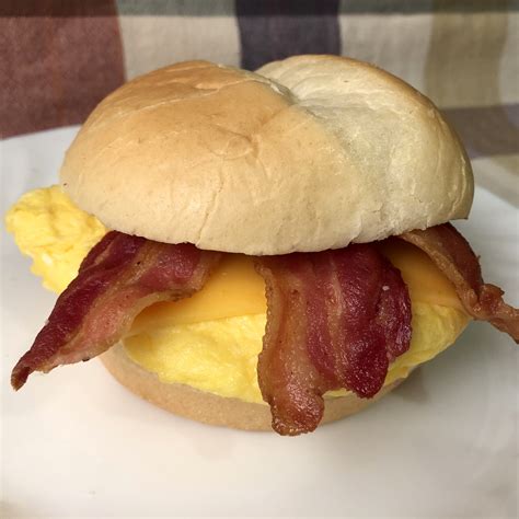 Bacon egg cheese sandwich. 1 Crumble the bacon and add to a cast iron skillet, set to medium high heat. Once it begins to sizzle, add a tablespoon of unsalted butter and add the eggs. 2 Scramble until softly set, remove from pan. … 