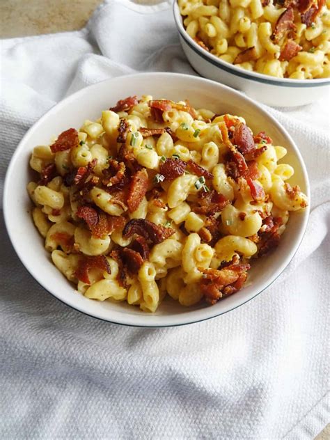 Bacon mac and cheese recipe. Slowly add milk a bit at a time whisking after each addition until smooth. Once all of the milk is whisked in, add cream cheese, salt, and garlic powder and whisk until smooth. Bring mixture to a boil over medium heat until thick and bubbly. Remove from heat and stir in 1 ¼ cups cheese, macaroni, and jalapenos. 
