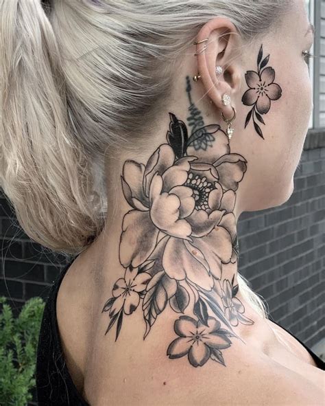 Badass neck tattoos for females. The flower making up part of the bee was a lovely addition and gives this black and gray bee tattoo a feminine touch. I love the little details, such as the fine hairs on the legs and the shine created by the white highlight in the wings. This is a lovely tattoo and a great way to honor bees. IG: allysia_tattoo. 