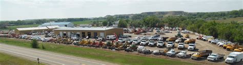 Badland Truck Sales, Inc. is located in Glendive, Montana, and services Montana, the Dakotas, and Wyoming region and beyond with a large selection of used trucks, trailers, farm equipment, and construction equipment. They have been serving customers both large and small since 1998, and offer delivery and shipping services upon request. . 