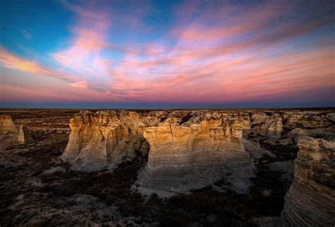 Patrick Emerson/Flickr. Castle Rock is an ever-shrinking rock formation in the badlands of Kansas. It stands alone surrounded by open ground and more badlands raised above the dirt. Slowly but surely, this formation will completely disappear as time erodes it away. Advertisement. 3. Little Jerusalem - Logan County.. 