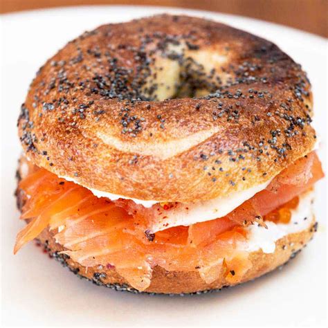 Bagel with lox and cream cheese. The lox and schmear likely originated in New York City and Philadelphia, both sites of significant Polish immigration, around the time of the turn of the 20th ... 