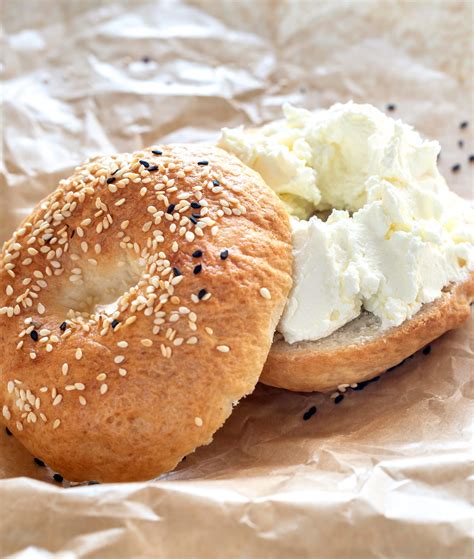 Bagels and cream cheese. Place both halves of the toasted bagel on a baking tray lined with parchment paper or aluminum foil. Step 3: Add Cream Cheese Spread an even layer of cream cheese over one or both halves of the toasted bagels based on personal preference. Step 4: Reheating Time Put the tray in the preheated oven for approximately five minutes. 