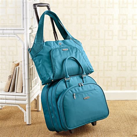 Baggalini. This large tote purse features plenty of interior compartments for your essentials, and the convenient luggage handle sleeve makes traversing terminals a breeze. Best of all, a secret phone pocket ensures you’ll never miss a picture-perfect moment! Staying organized has never been easier. ★★★★★ ★★★★★. 4.3. 26 Reviews. 