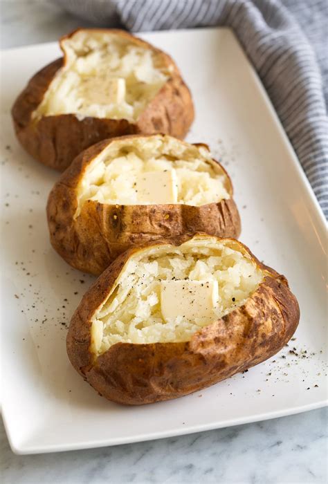 Baked potato news. Instructions. Heat your oven to 400°F. Scrub the potatoes well then pat them dry. Using a sharp knife, cut an X across the top of each potato by making a ¼-inch deep incision from one end of the potato to the other lengthwise, then making a second cut across the center of the potato. 