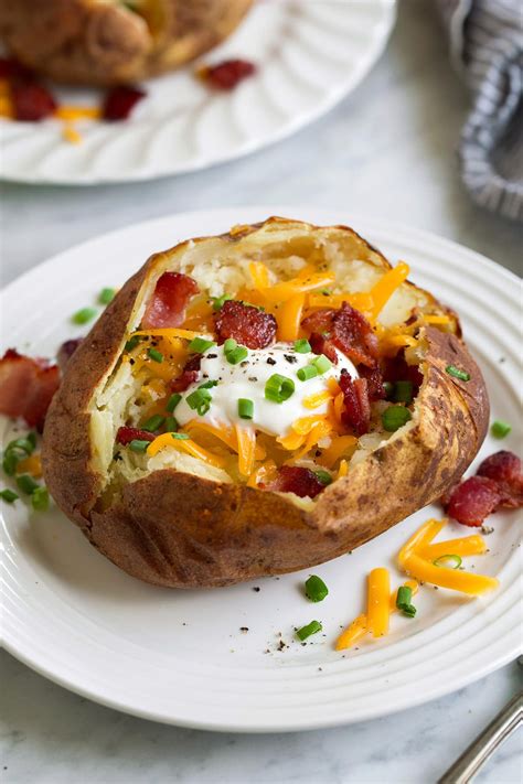 Baked potato quick. Preheat the air fryer to 350°F (180ºC). Clean the potatoes and prick them with a fork on every side. Place them in the air fryer basket, spray with cooking spray, and season with salt and pepper. Cook at 350°F (180ºC) for 25 minutes. Let them cool and cut them with a knife lengthwise. 