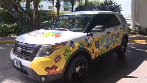 Bal Harbour Police Department unveils cruiser design in support of Autism Awareness Month