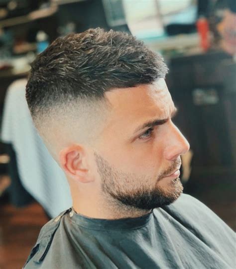 The sides receive a mid bald fade to provide a hefty amount of 