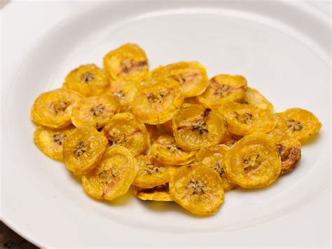 Banana chips. 3. grate the banana with the slicer part of a box grater or use a mandolin. 4. arrange the slices in the basket of the air fryer and cook at 380 F (195 C) for 8 minutes; check for doneness and cook for another 2 to 3 or until golden and crispy. Enjoy these banana chips immediately, or store them in an air-tight container for up to a week. 