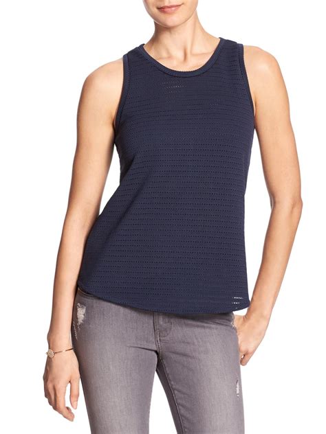Shop Banana Republic's The Racer Tank: A timeless classic, crafted from one of our best-selling fabrics, this sleek tank has a high, racerneck designed to fit and flatter as you transition through the seasons., FITTED: Stretches to fit., SUSTAINABILITY: Made with LENZING™ ECOVERO™, a breathable fiber derived from certified renewable wood …. 