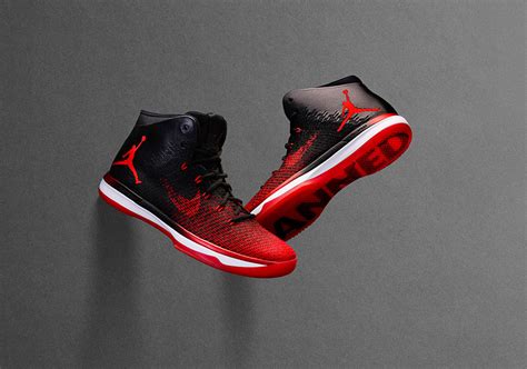 The Air Jordan 31 is a silhouette inspired by the Air Jordan 1, Jordan’s first pair of kicks. It is available in different designs and colorways, including the Black/White/University Red “Banned” colorway. Air Jordan 31 sneakers feature an upper built with flexible Flyweave on the forefoot and synthetic leather in the heel section. 