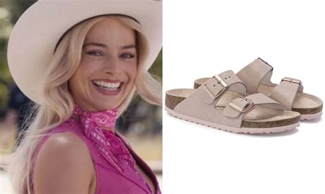 Barbie pink birkenstocks. There’s a wide variety of Birkenstocks available, like the comfy clogs, waterproof sandals, and now even trainers, but it’s the recognisable Arizona two-strap sandals that appear in the Barbie movie. While they’re brown with a cork sandal, there are plenty of pink sandals that fit perfectly with the lead character’s bubblegum outfits. 