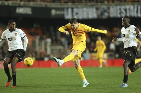 Barcelona held at Valencia for third game without a win. Sevilla fires coach Diego Alonso