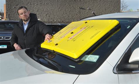 The Barnacle is a mechanism, like the Denver Boot, to immobilize cars whose owner seems to have unpaid parking tickets. It is a bright yellow piece of equipment that nearly covers a front windshield, sticking to it with, according to the website Barnacleparking.com, “1,000 pounds of force.”. Lest the driver not get the idea that this is the .... 