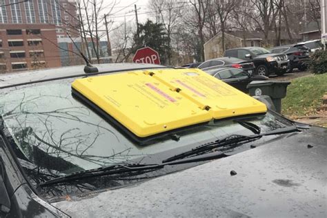 Barnacle windshield boot. The pilot program will use the "Barnacle" instead of the current parking-enforcement boot. The Barnacle is a large yellow clamp that attaches to a vehicle's windshield through suction cups. It effectively blocks a driver's ability to see out their windshield. 