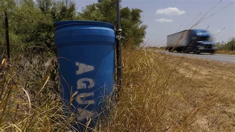 Barrels of drinking water for migrants walking through Texas have disappeared