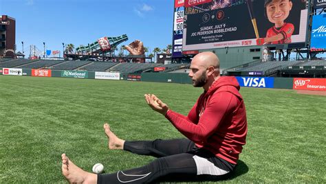 Baseball players are staying mindful on the diamond with barefoot walks in the grass