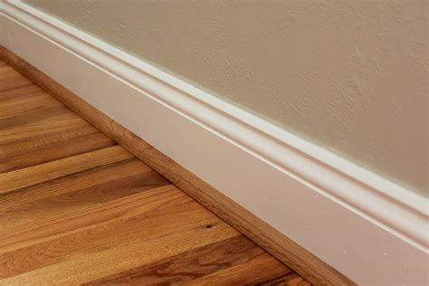 Baseboard and quarter round. 4.) If you are painting baseboards on a hardwood floor, then you should apply the painter’s tape beforehand along the quarter round making sure to carefully seal the edge so there isn’t any bleed through. I always use a paint shield and painter’s tape when I paint baseboards on top of hardwood floors. 