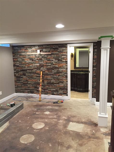 Basement walls. Masonry: Concrete cinder blocks, bricks, and stone are all examples of masonry walls. Cinder blocks create a rough, uneven surface that can be difficult to work with. Brick and stone are more common in older homes and look beautiful when maintained and left unadorned. Precast panels: This is the least common … 