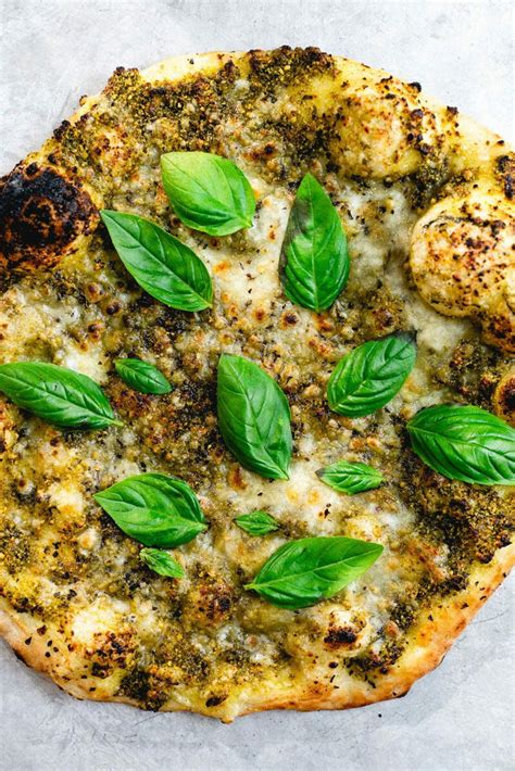 Basil on pizza. Heat a heavy skillet to medium and add a drop of oil. Place the pizza in the skillet, and cook for 2 minutes, until the bottom is crisp. Turn the heat to low and add 2 drops of water along the edge of the … 