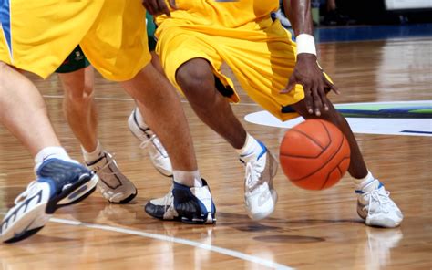 Basketball athletic. Basketball is a sport where two teams compete to score the most points, with the objective of shooting a ball into a hoop to gain points. 