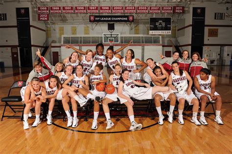 Most college basketball team photos feature players, in uniform, 
