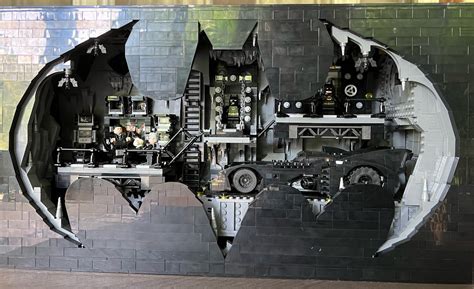 Batcave shadow box. A Batman tableau – Adult enthusiasts can capture the drama and style of the Batcave from 1992’s Batman Returns movie with the LEGO DC Batman Batcave – Shadow Box (76252) active display model. Authentic details – The scene includes a feature-rich Batmobile and 7 minifigures: Max Shreck, The Penguin, Catwoman, 2 versions of Batman, Alfred ... 