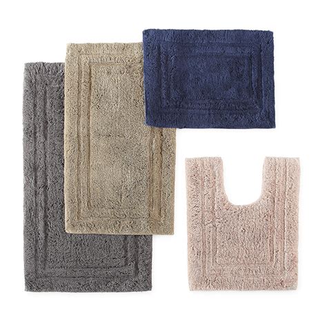 Traditional bath rugs by Garland Rug are soft and stylish. The plush design lends a classic understated touch to your bath coordinates collection. This 3-piece rug set comes with an 21 inch x 34 inch bath mat, 21 inch x 24 inch toilet contour and a 17 inch x 14 inch universal toilet lid cover designed to fit most toilet lids.