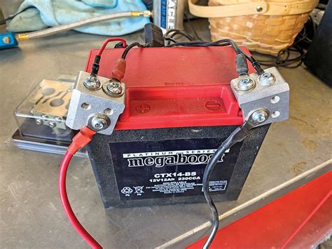 Battery Terminal Extender. Consist of two 3-lug bus bars, red for positive, black for negative, constructed out of marine grade anti-corrosive stainless steel which provides for even and consistent power distribution. Provides easily identifiable 12v power connection vs. ganged overloaded single terminal connection. Manufactured in the USA.. 