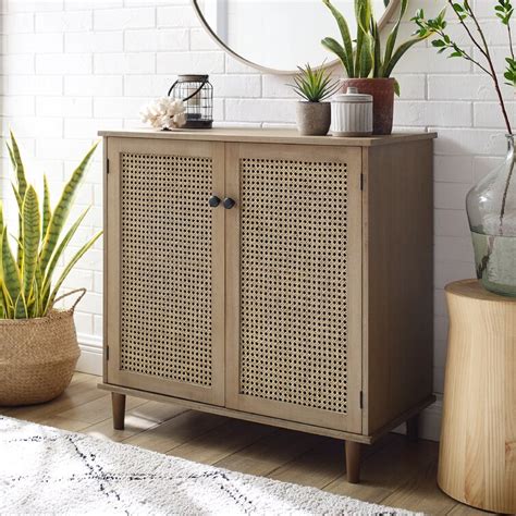 Description. This Bohemian-style freestanding shoe cabinet ensures that your shoe collection remains neat and organized. Eight storage compartments, each compartment can comfortably accommodate two pairs of shoes, depending on the size of the shoes. This unit is made of an engineered wood frame, naturally breathable rattan veneer, and metal legs.. 