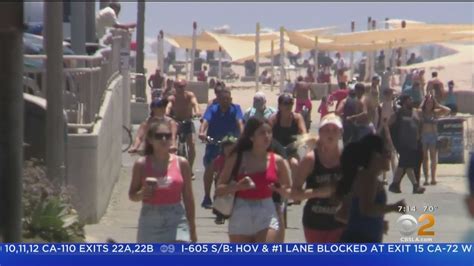 Beachgoers head to Huntington beach to beat the heat 