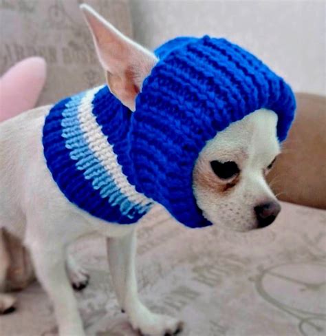 Beanie for dogs with ear holes. The 'mohawk' hair is black. There is a red scar and 2 gray bolts on either side. The hat has holes for your dog or cat's ears and is tied under the chin. These beanies are sized for toy & small dogs and most cats. This hat has holes for its ears. The sizing is based on the space between the ears. XS - 2" between ears S - 3" between ears M - 4 ... 