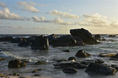 Beautiful sun shining on the rocks in aruba. Free Photo