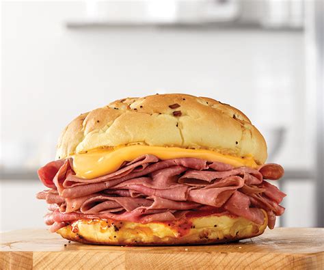Beef and cheddar. Hearty portions of roast beef & cheddar cheese on enriched white bread. 
