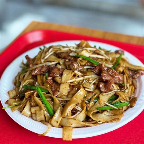 Beef ho fun. The Spruce / Cara Cormack. Cut the noodles into 1/2- to 3/4-inch strips. The Spruce / Cara Cormack. Once the beef is done marinating, heat a wok or a large skillet, add 1 tablespoon of oil, and stir fry the beef until it browns. The Spruce / Cara Cormack. Stir in the black bean sauce and stir fry for another 30 seconds. 
