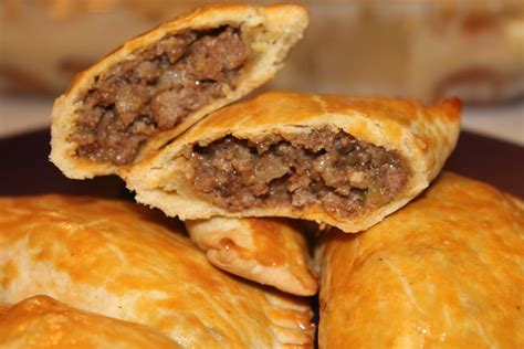 Beef patties jamaican. Preheat oven to 200°C (392°F) and place the oven rack to the middle position. Line a baking pan with parachment paper. Remove the pastry dough from the fridge and place onto a slightly floured working surface. Using a rolling pin, sheet the dough thin, about 3mm in thickness. 