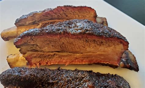 Beef plate ribs. 3. When ready to cook, preheat the Traeger with the lid closed to 250°F; this will take about 15 minutes. 250 ˚F / 121 ˚C. 4. Holding a leave-in meat thermometer parallel to your work surface, insert it in the center of a meaty side of the ribs avoiding any bone. Place the ribs meat side up on the grill grates. 