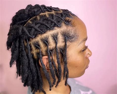 12. Twisted Dreadlocks Bun and Undercut. If a beautiful dreadlock bun wasn’t show-stopping enough, add an undercut too! This hairstyle is perfect for women who find a full head of dreadlocks is a bit too much. Practicality aside, the half dreaded look is also really, really cool. @alexianna_styles.