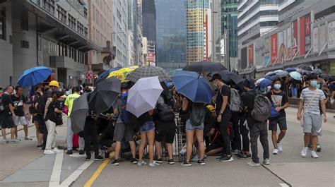 Beijing strikes cautionary tone on protests in Hong Kong