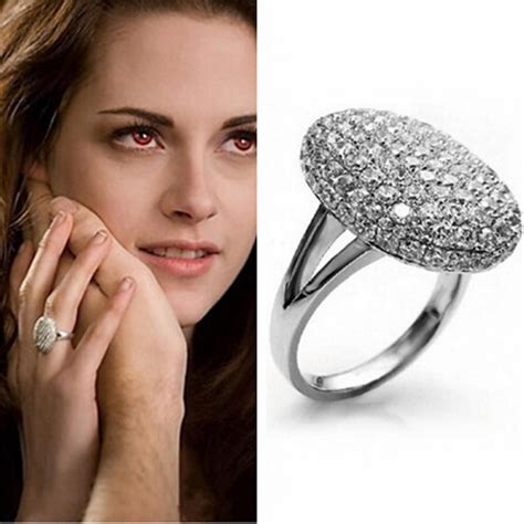 Bella swan engagement ring. A whopping 900 props from the Twilight film series will soon be up for grabs in an auction and among them is Bella Swan's engagement ring, bouquet, wedding hair comb, and the gorgeous lace and ... 