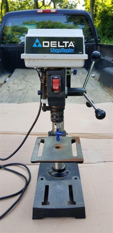 Benchtop delta drill press. The Stop Block. The last thing needed to complete this drill press table is the stop the block. I cut a 2-1/2″ x 2-1/2″ piece of plywood for the stop block. I then drilled a whole in the center and attached it to the fence with a 1″ long 1/4-20 t bolt and knob. With that, the drill press table was done! 
