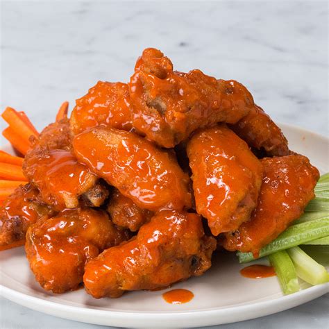 Best buffalo wings in buffalo. Preheat the oil in a deep fryer to 350°F (180°C). Line a baking sheet with paper towels or top with a wire rack. On a work surface, section the chicken wings by cutting the joints to obtain 3 pieces. Discard the wing tips and keep the drumettes and wingettes. Pat dry with paper towels. 